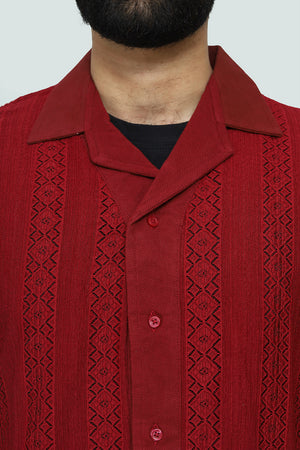 Red textured shirt with a cuban collar on a plain background